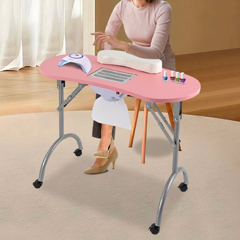 Table manucure pliante rose avec aspirateur en utilisation